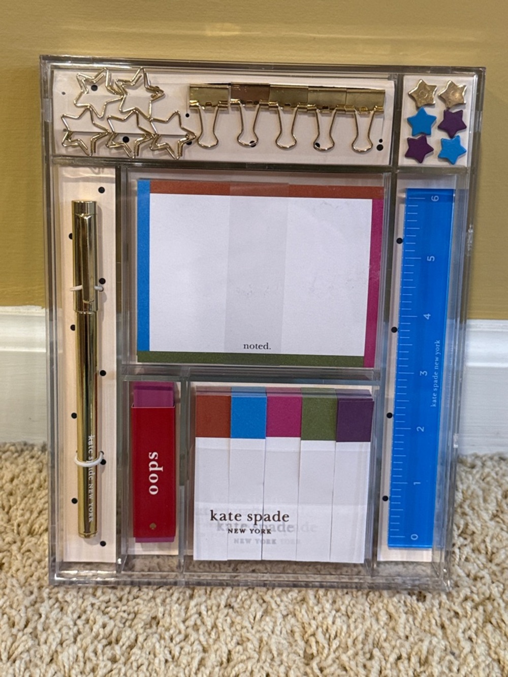 kate spade acrylic desk organizer with gold accents and bright notepad